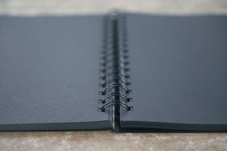 Black notebook on the deskの写真素材