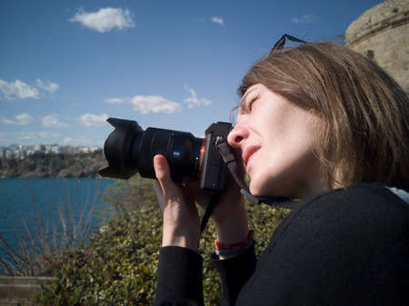 Woman photographer taking pictures