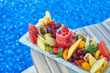 Delicious Tropical Fruits and Poolの写真素材