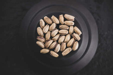 fresh and delicious pistachios on the tableの写真素材