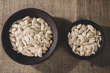 fresh and delicious pumpkin seeds on the tableの写真素材
