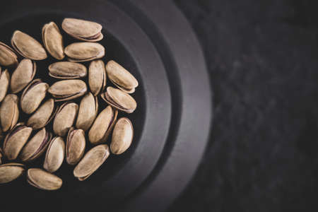 fresh and delicious pistachios on the tableの写真素材