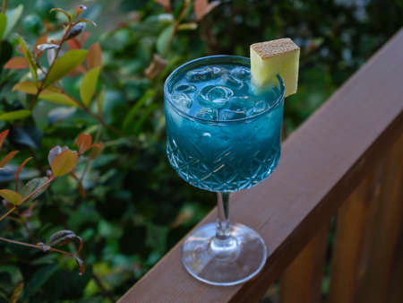 a delicious and cold blue alcoholic cocktailの写真素材
