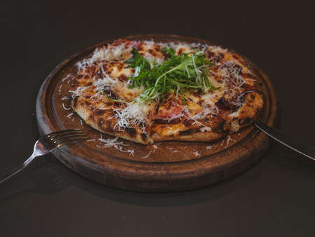 fresh Italian pizza in a restaurantの写真素材