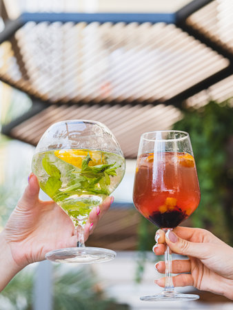a couple drinking cocktails at a celebrationの写真素材