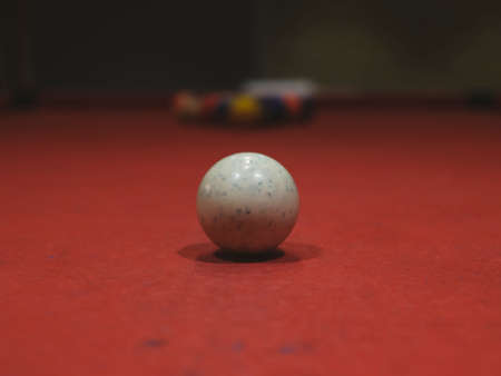 billiard balls on red pool tableの写真素材