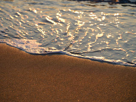 sea waves on the beach at sunset