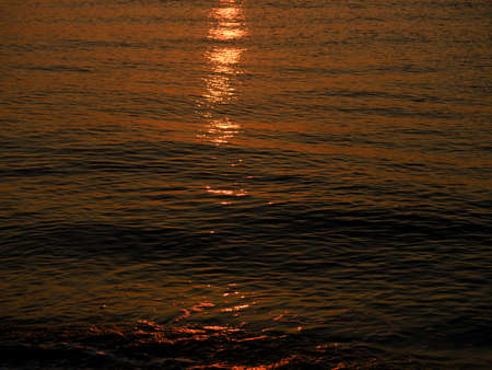 beautiful sea waves at sunsetの写真素材