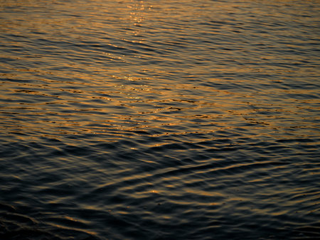 beautiful ocean waves at sunsetの写真素材