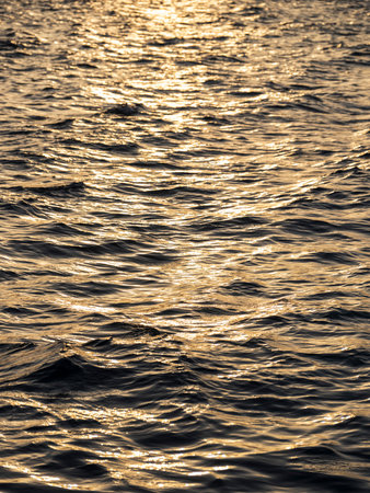 wonderful sea waves at sunsetの写真素材