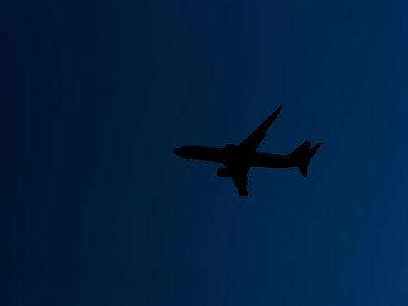 an airplane in the blue skyの写真素材