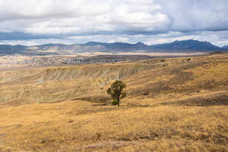 View of the peninsula Meganom and the steppe mountains of the Kapsel valley. Village. Lean...