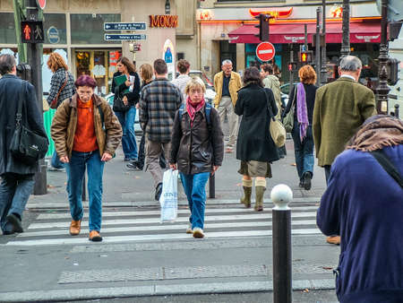 Paris, France -18 October 2005: An ordinary day in Montmartre. People at a pedestrian crossing. Overcast, autumnのeditorial素材