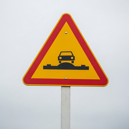 Traffic sign on a road with a car on the road.の素材