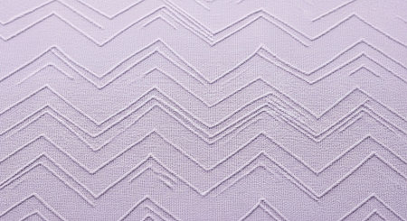 a textured lilac fabric featuring a repeating chevron pattern with a zig zag design.の素材
