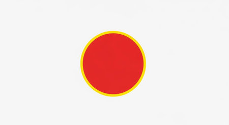 A vibrant red circle is bordered by a yellow outline, creating a simple yet striking geometric illustration.の素材