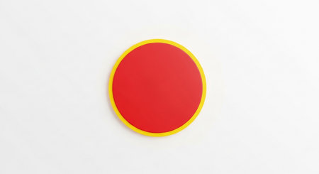 a vibrant red circle with a yellow border, set against a clean white background, perfect for design projectsの素材