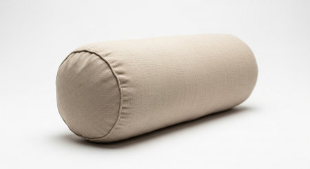 a simple beige bolster pillow, perfect for neck support and home decor accents.の素材