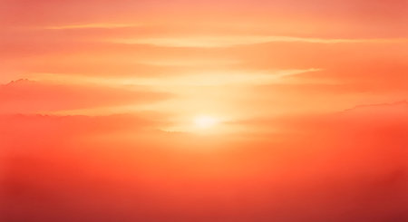 a breathtaking orange sunset sky with soft clouds creating a serene and beautiful backgroundの素材