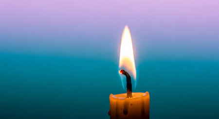 candle light on blue background with copy space for your text.の素材