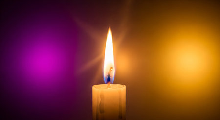 Burning candle on a dark background. The concept of Christmas and New Year.の素材
