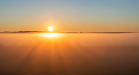 Panoramic view of a foggy sunrise over the river.の素材