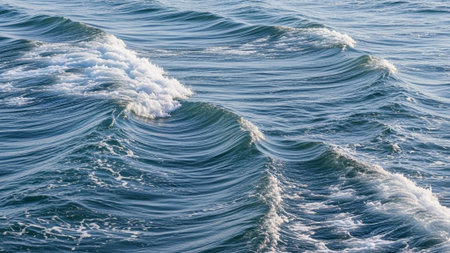 Sea wave with foam on the surface of the water close-upの素材