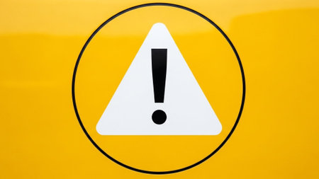 exclamation mark on a yellow car - closeup of a warning signの素材