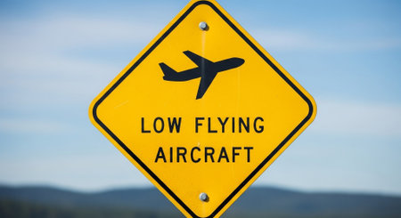 Low Flying Air Traffic Sign on a Blue Sky Background with Copy Spaceの素材
