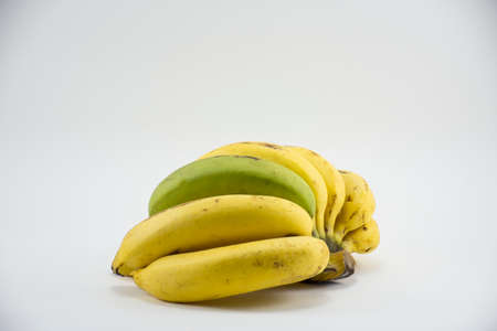 Yellow and green banana isolated on white background.fruit background or food for health.And fruit for health or Fruit of energy or food of energy and healthy care .fat or low fat or low calorie with hi calorie.の写真素材