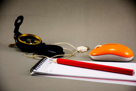 Background Travel plan,Note book,compass  and optical mouse, on gray background or networking...