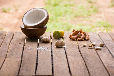 Raw material for food and dessert.Lemon and coconut  and turmeric on old wooden background outdoor.Raw material Asia food.Raw material Indian foodの写真素材