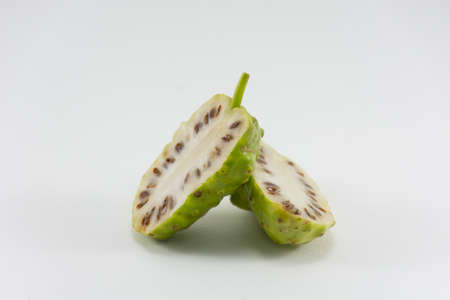 Noni and noni slice isolated on white background.Fruit  for health and herb for healthy care.1の写真素材