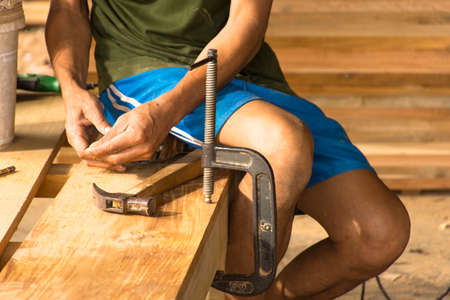 Carpenter working with equipment in his hand  plan.Zoom in  and stillife.の写真素材