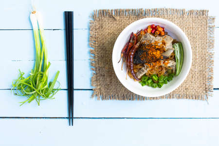 Noodles in Thailand Beef noodle on wooden sky blue table.top viewの写真素材