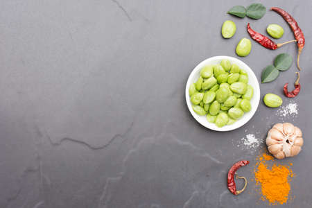 Parkia speciosa dish and ingredient  for thai food hot and spicy menu with black background.の写真素材