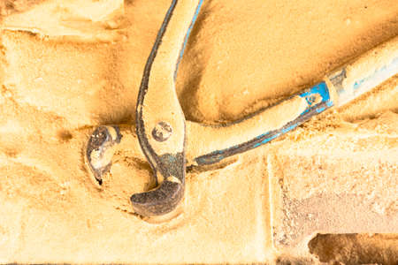 Pliers tool for carpenter on sawdust table background.Equipment for crafts in workplace.の写真素材