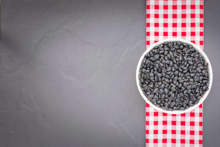 Black bean in bowl isolated. On black background,Top view and close up.の写真素材