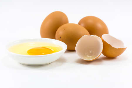 Egg dish and fresh eggs and egg shell isolated on white background.Raw food or meal Hi-protein.の写真素材