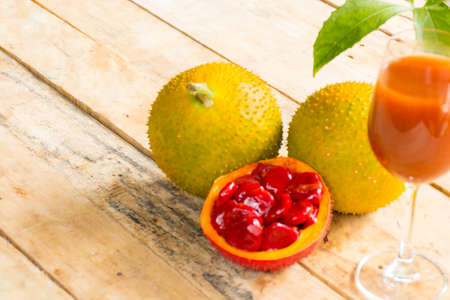 Green baby Jackfruit and juice on wooden background.fruit for health and stillife.の写真素材