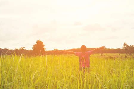 Child happy with mountain view,Or boy happy for travel and relax with mountain and sunshine view.の写真素材
