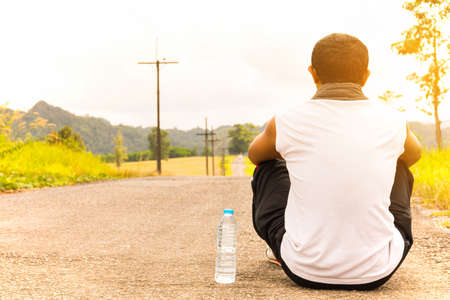 Asian sport man relax after exercise  with nature outdoor view.の写真素材
