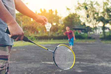 Father and son playing badminton.Family with activity.Zoom inの写真素材