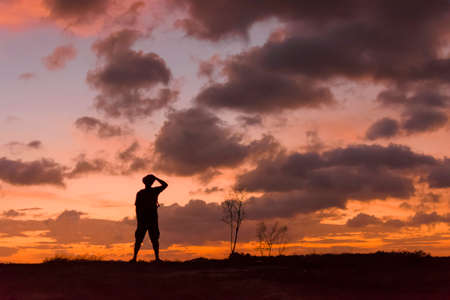 Man hipster looking sunset view.Silhouette conceptの写真素材