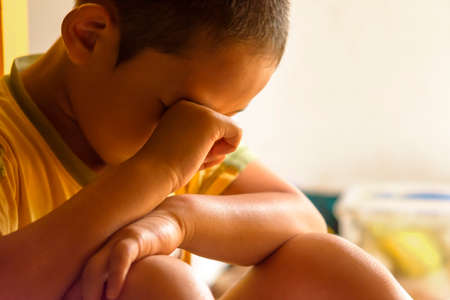 Child Asian crying  in the room.Alone orSocial reflection conceptの写真素材