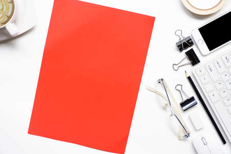 White desk office with smartphone and red paper and equipment.Concept office,Top viewの写真素材