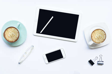 Smartphone with Tablet computer and coffee cup  and  etc on isolated.Top view and zoom inの写真素材