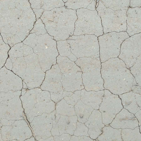 Dry cracked earth background. Cracks in the ground texture.