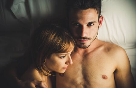 Couple in love having a romantic moment in the bedroom.の写真素材