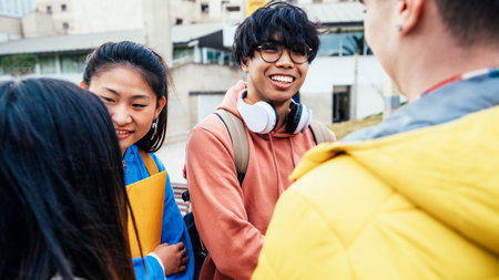 Happy young people having fun in college campusの写真素材
